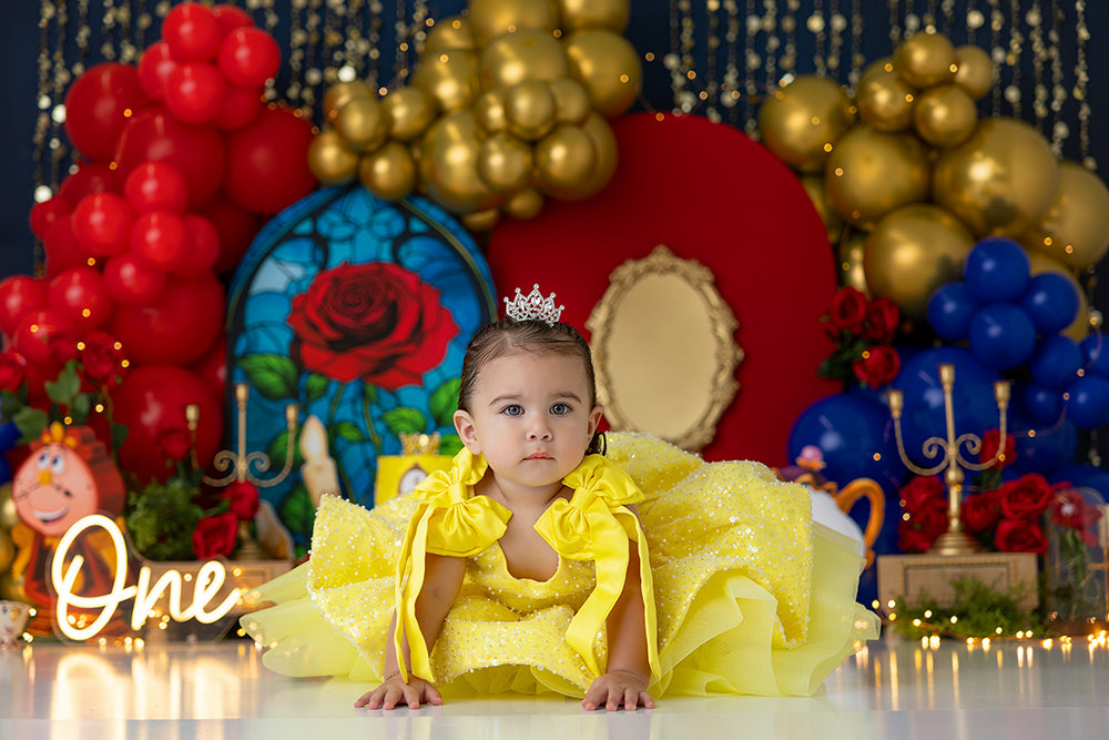 Enchanted Rose Ballroom backdrop with stained glass rose, red and gold balloons, and candelabras