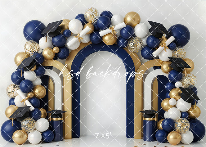 Navy gold graduation arch photography backdrop with navy, white, and gold balloons, graduation caps, diplomas, and layered arch details for formal portrait sessions.