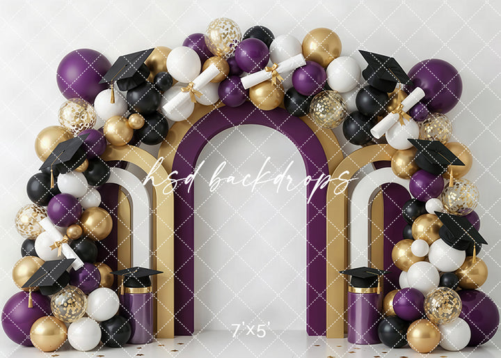 Purple gold graduation arch photography backdrop with purple, black, white, and gold balloons, graduation caps, diplomas, and layered arch details for portrait photography.