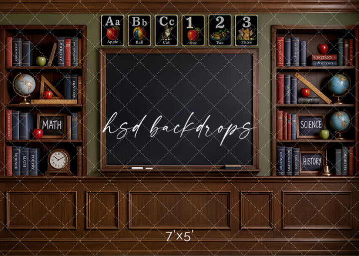 Classic classroom chalkboard photography backdrop with a large chalkboard, wooden bookshelves, books, globes, rulers, apples, and vintage schoolroom details for back-to-school portraits.