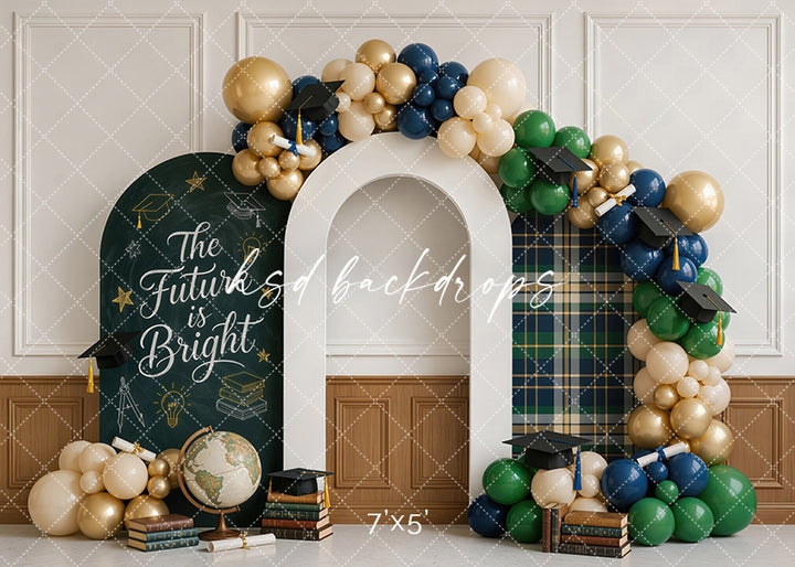 The Future Is Bright graduation photography backdrop with a white arch, navy green and gold balloons, graduation caps, books, globe, plaid accents, and chalkboard-style school message.