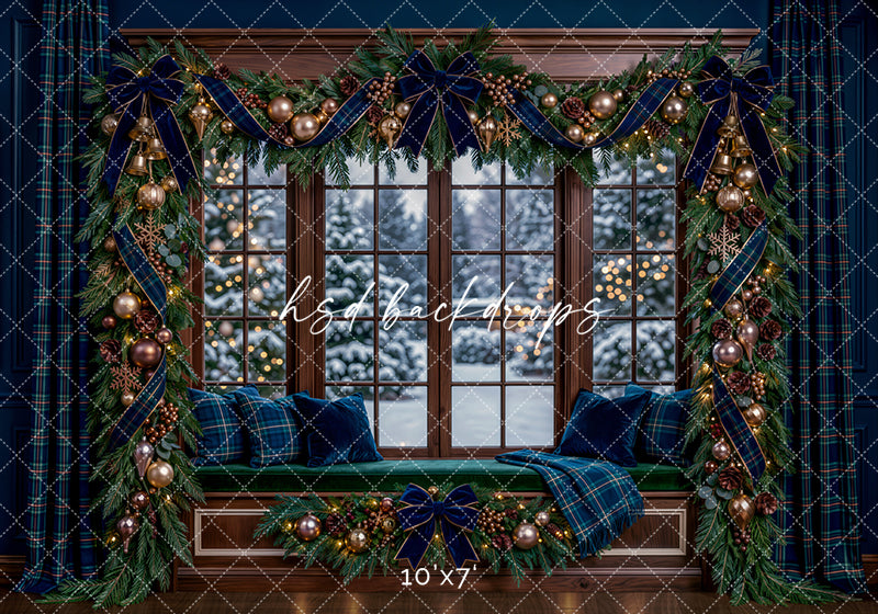Navy Plaid Christmas Window photography backdrop featuring a cozy window seat, snowy evergreen view, lush garland, navy velvet bows, plaid ribbon, metallic ornaments, pinecones, and warm holiday lights.