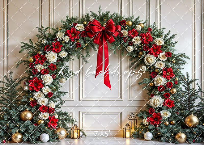 Christmas arch backdrop with red poinsettias, white roses, greenery, and gold ornaments for holiday photography