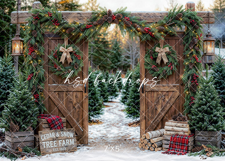 Cedar and Snow Tree Farm photography backdrop with rustic wooden gates, evergreen garland, wreaths, lanterns, plaid accents, snow, and Christmas trees for holiday portrait photography.