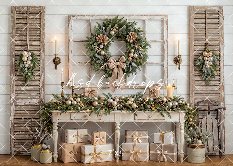 Heirloom Console Christmas photography backdrop with a weathered console table, rustic shutters, wreath, garland, candles, wrapped gifts, and elegant holiday décor for portrait photography.