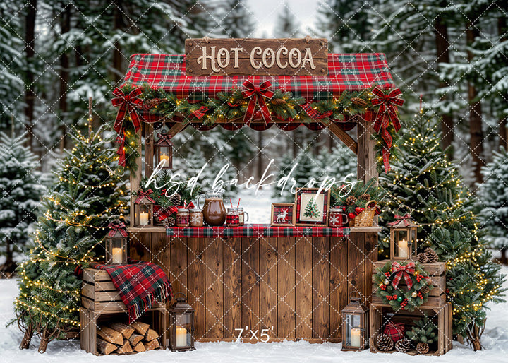 Plaid Hot Cocoa Booth photography backdrop with a rustic wooden cocoa stand, plaid awning, festive garland, lanterns, evergreen trees, and cozy holiday décor for portrait photography.