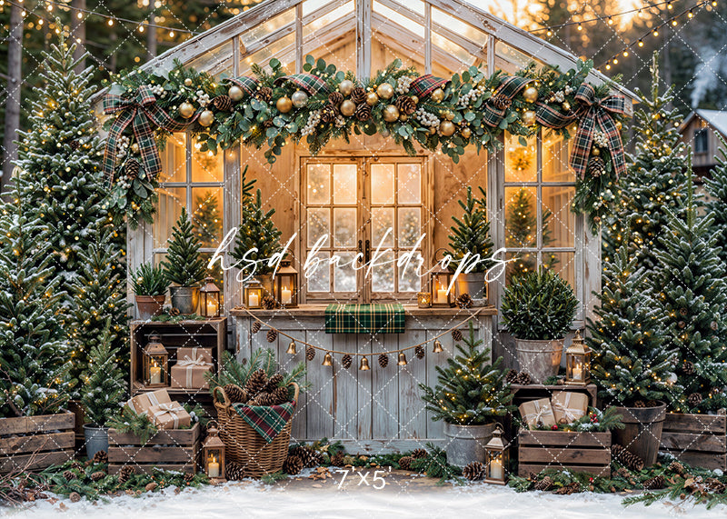 Plaid Garland Greenhouse photography backdrop with a glowing holiday greenhouse, plaid ribbon garland, evergreen accents, lanterns, potted trees, wrapped gifts, and snowy winter décor.