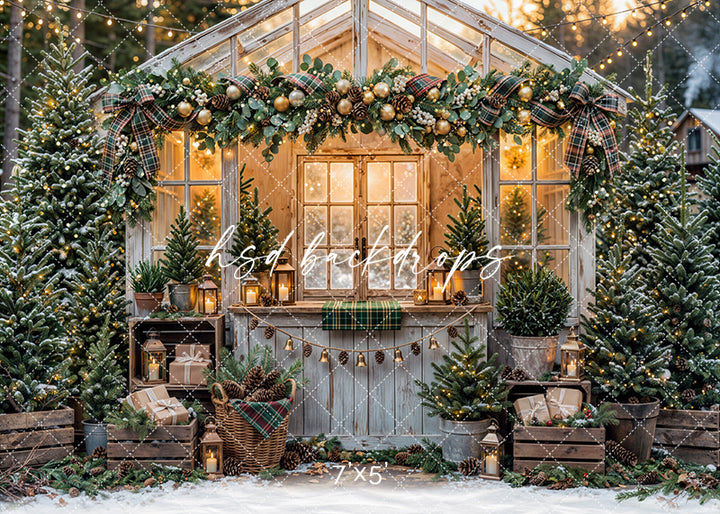 Plaid Garland Greenhouse photography backdrop with a glowing holiday greenhouse, plaid ribbon garland, evergreen accents, lanterns, potted trees, wrapped gifts, and snowy winter décor.