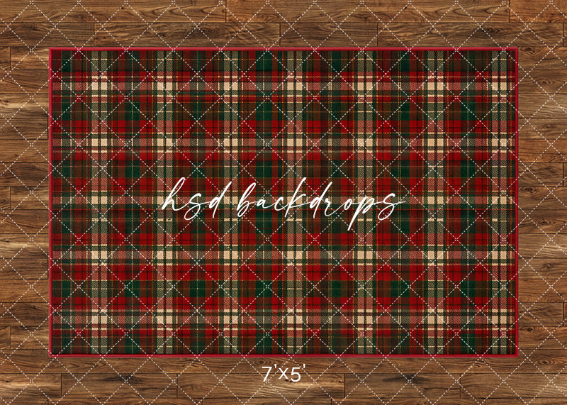Classic Christmas Plaid photography floor backdrop with a red, green, and cream tartan pattern over a warm wood floor for holiday portrait photography.
