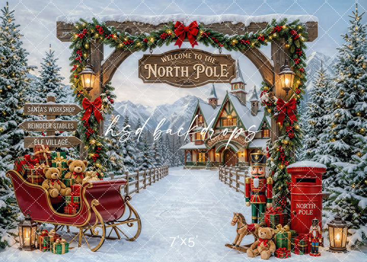Welcome to the North Pole photography backdrop with snowy Santa village, red sleigh, Christmas garland, wrapped gifts, teddy bears, nutcrackers, and festive holiday lights.