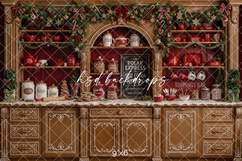 Gingerbread hot cocoa bar photography backdrop with red Christmas shelves, cocoa jars, baking supplies, cookies, candy canes, garland, plaid bows, and festive holiday kitchen décor.