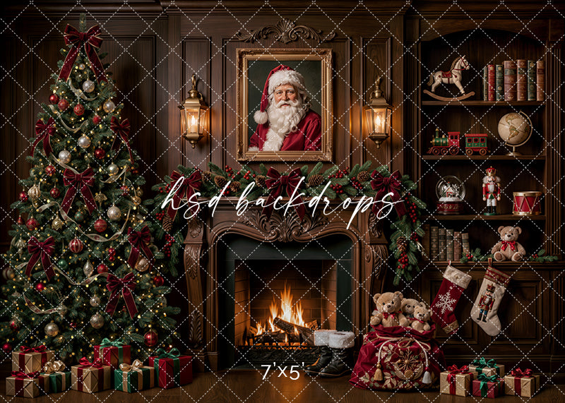 Santa’s Fireside Library photography backdrop with glowing fireplace, framed Santa portrait, decorated Christmas tree, wood-paneled library shelves, teddy bears, stockings, wrapped gifts, and classic holiday décor.