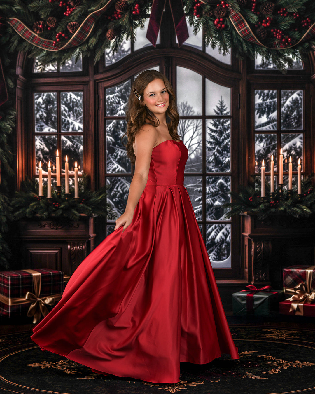 Burgundy evergreen window holiday backdrop with rich wood window frame, snowy winter trees, layered garland, red ribbon bows, glowing candles, and classic Christmas portrait décor.