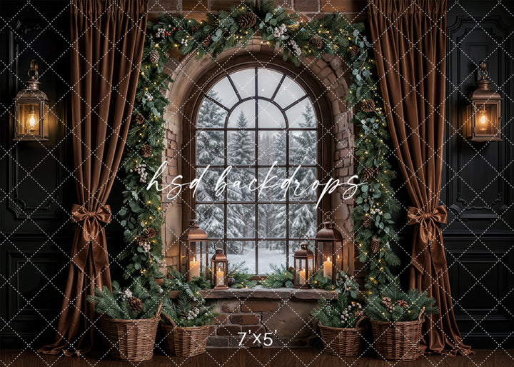 Evergreen Stone Window Christmas photography backdrop with stone arched window, snowy winter view, evergreen garland, glowing lanterns, brown drapes, pine baskets, and cozy holiday room styling.