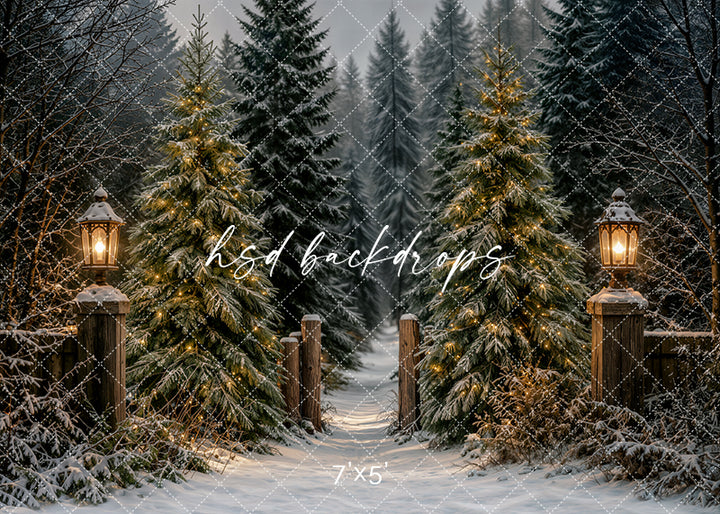 Lantern Lit Christmas Forest photography backdrop with snowy evergreen trees, glowing lanterns, rustic fence posts, frosted branches, warm lights, and cozy winter holiday forest styling.