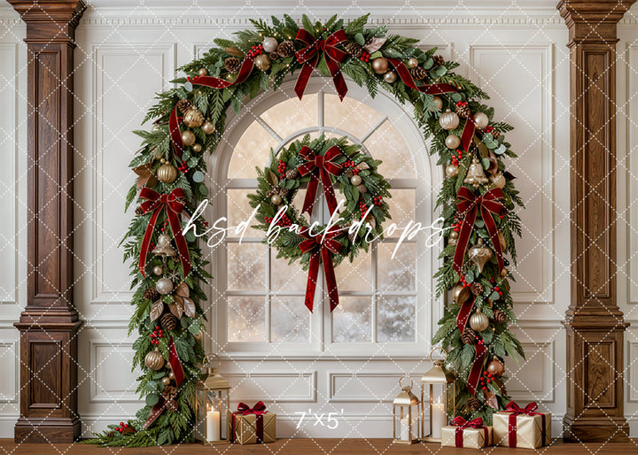 Evergreen Christmas Window photography backdrop with arched snowy window, lush garland, burgundy bows, gold ornaments, lanterns, wrapped gifts, warm wood columns, and elegant ivory holiday room styling.