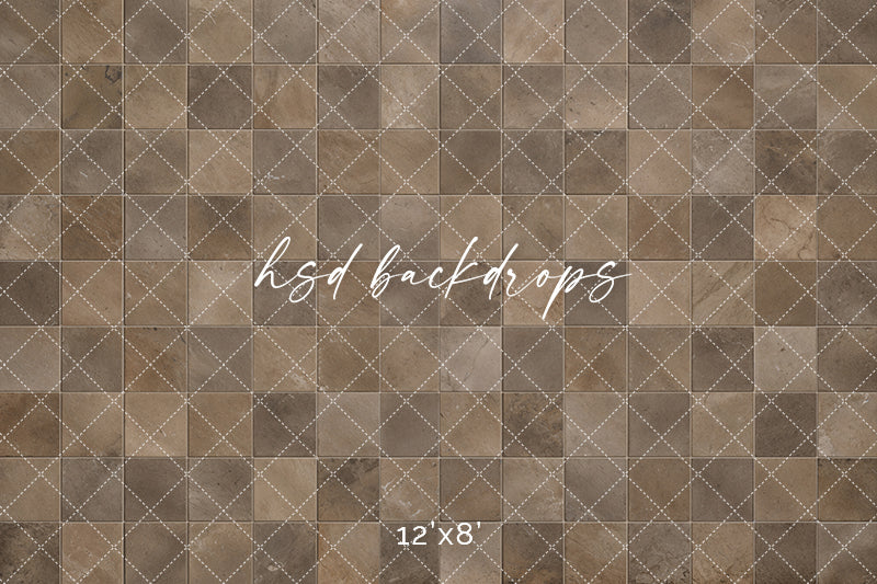 Natural stone tile photography floor backdrop with square brown and taupe tiles, subtle veining, distressed stone textures, and evenly spaced grout lines.