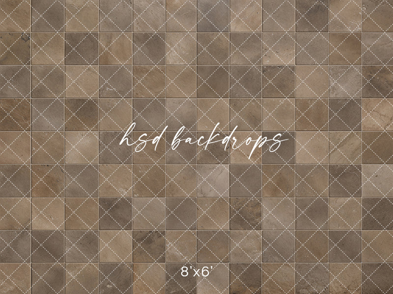 Rustic brown stone photography floor backdrop with weathered square tiles, natural stone markings, warm taupe tones, and subtle grout lines for studio portraits.