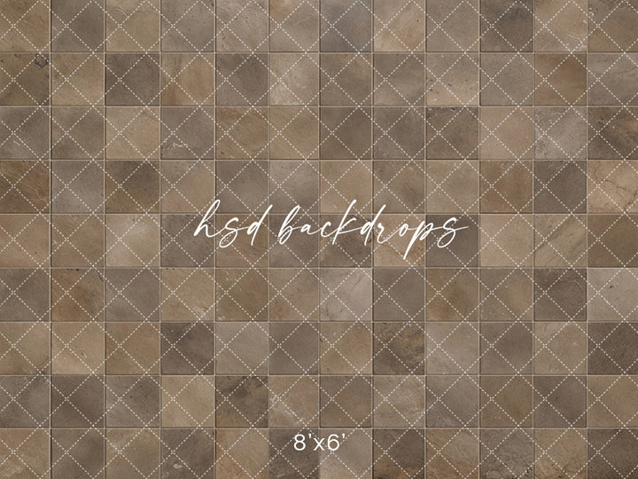 Rustic brown stone photography floor mat with weathered square tiles, natural stone markings, warm taupe tones, and subtle grout lines for studio portraits.