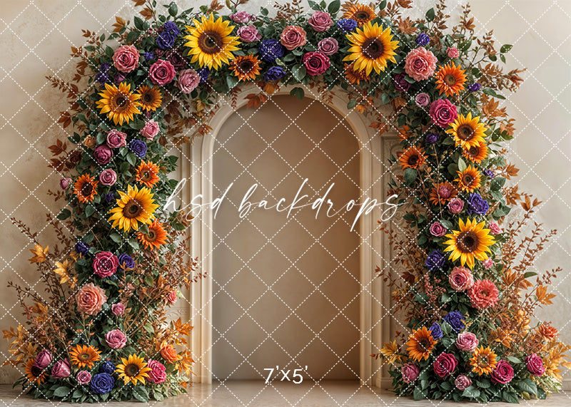 Autumn floral arch backdrop with sunflowers, roses, and fall foliage