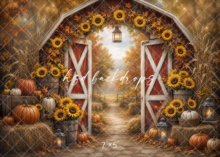 Sunflower Harvest Barn photography backdrop with rustic red barn doors, golden sunflowers, pumpkins, hay bales, lanterns, corn stalks, autumn leaves, and a warm fall garden path.