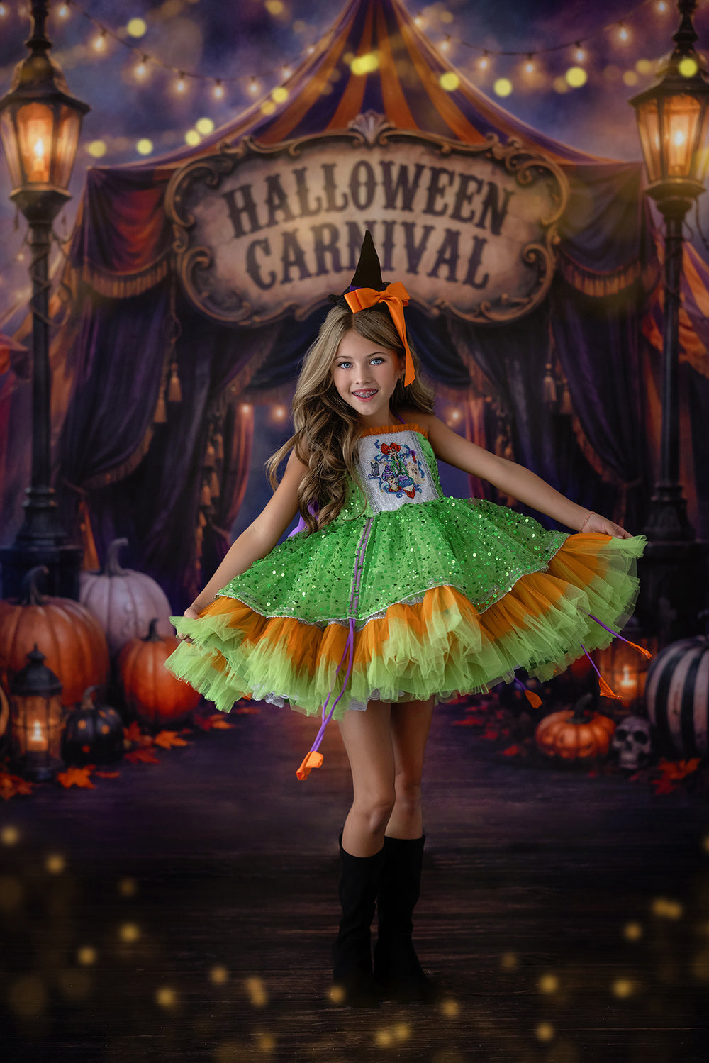Spooky carnival entrance photography backdrop with Halloween carnival tent, glowing lights, pumpkins, lanterns, purple and orange drapery, and festive Halloween portrait styling.