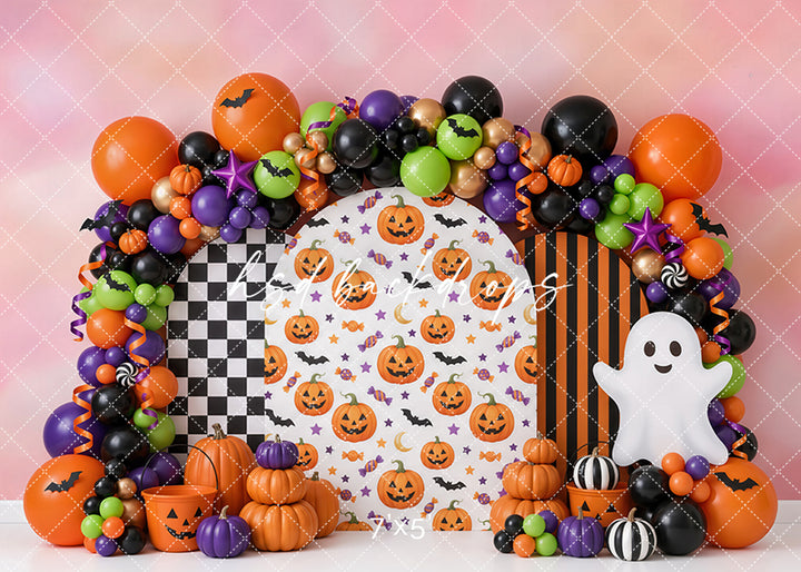 Happy Haunts Halloween photography backdrop with colorful balloon garland, smiling pumpkins, friendly ghost, checkerboard accents, orange and black stripes, and playful studio styling.