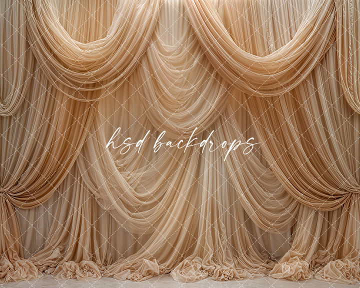 Beige champagne draped fabric photography backdrop with elegant cascading curtains.