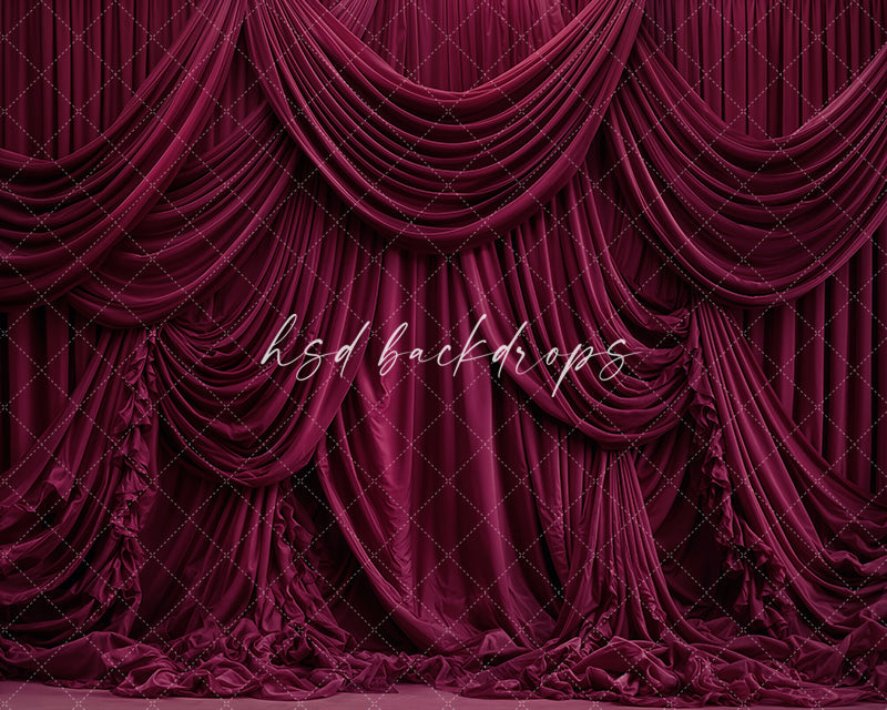 Burgundy draped fabric photography backdrop with elegant layered curtains.