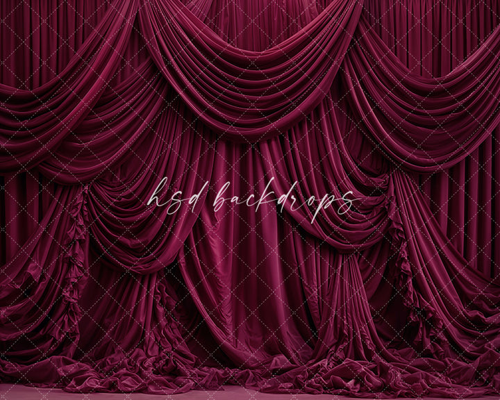 Burgundy draped fabric photography backdrop with elegant layered curtains.