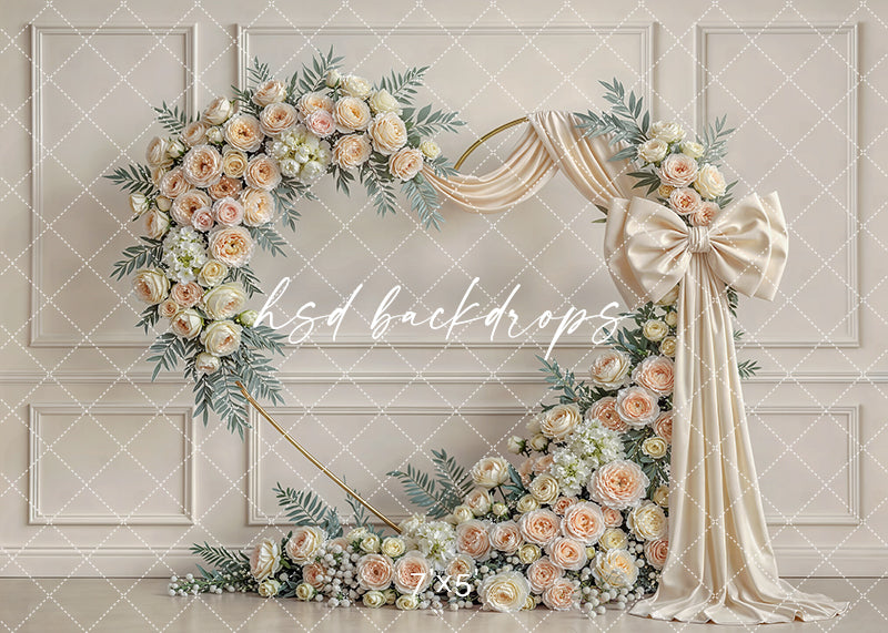 Ivory rose bow floral arch photography backdrop with champagne florals and neutral drapery, elegant Mother’s Day and milestone portrait background.
