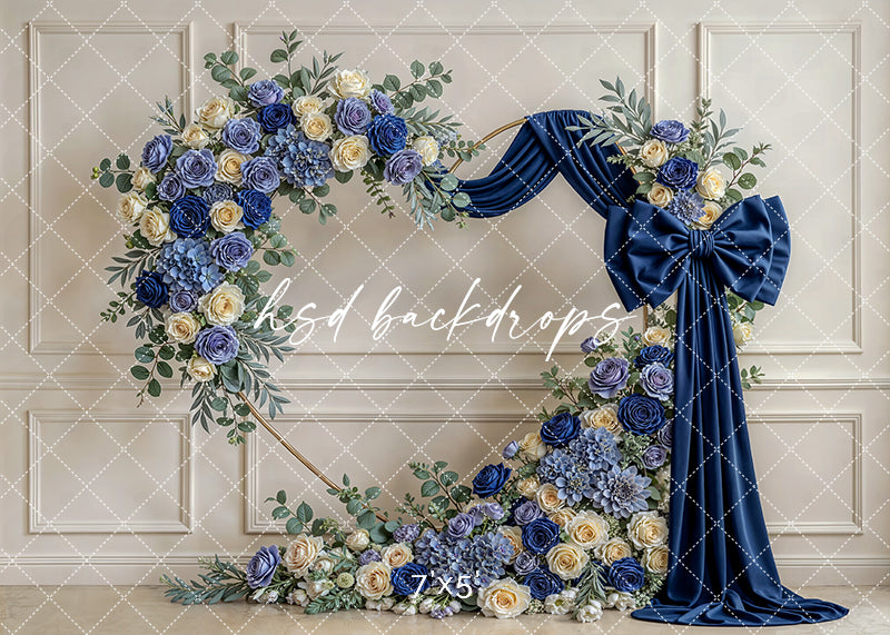 Navy blue rose bow floral arch photography backdrop with royal drapery and layered florals, formal quinceañera and Sweet 16 portrait background.
