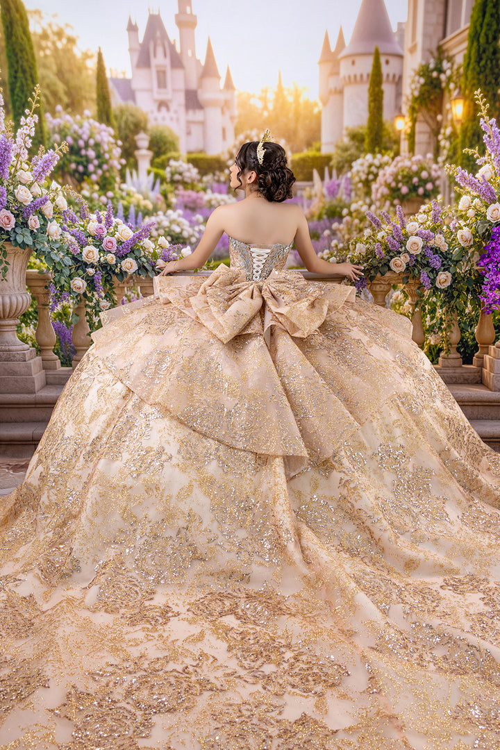 Enchanted lavender palace garden quinceañera photography backdrop featuring romantic purple florals, ivory roses, elegant stone balustrades, and a quinceañera in a sparkling champagne gold ball gown.
