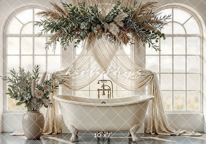 Neutral botanical bathtub photography backdrop with clawfoot tub, arched windows, draped fabric, and greenery for elegant maternity and motherhood portraits.