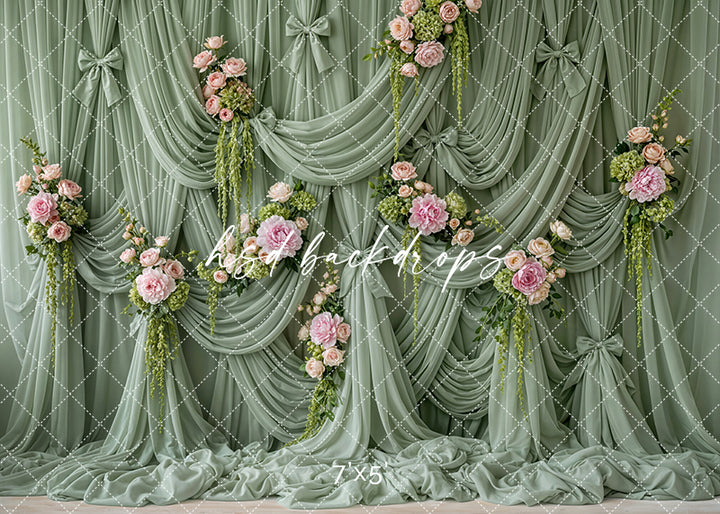 Sage green draped floral photography backdrop with cascading pink garden roses and romantic fabric styling for Mother’s Day and spring portraits.