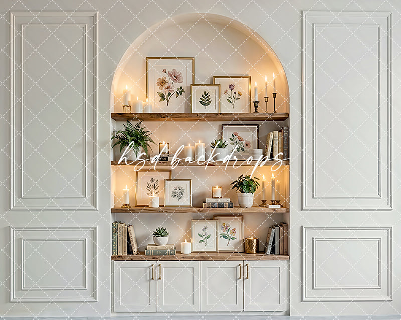 Neutral candlelit shelf nook photography backdrop with wooden shelves, candles, botanical décor, and elegant interior paneling for branding portraits.
