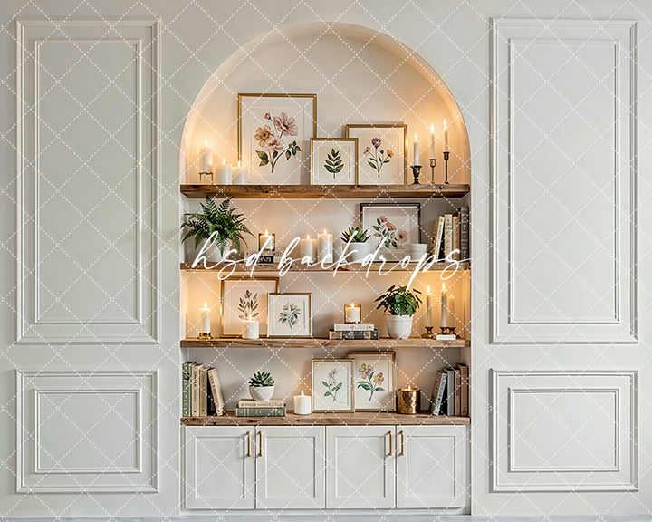 Neutral candlelit shelf nook photography backdrop with wooden shelves, candles, botanical décor, and elegant interior paneling for branding portraits.