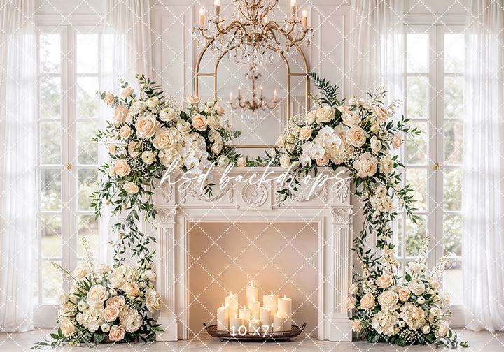 Ivory rose fireplace photography backdrop with white fireplace, chandelier, arched mirror, sheer curtains, glowing candles, and soft floral arrangements for elegant maternity portraits.