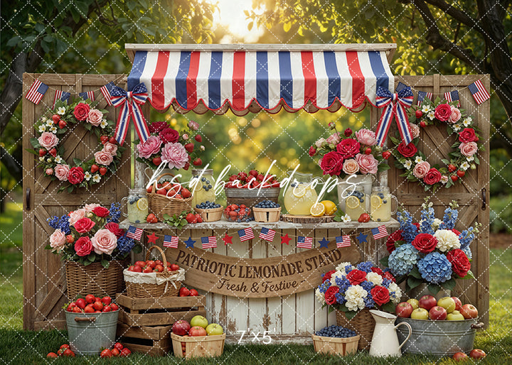 Patriotic lemonade stand garden photography backdrop with red white and blue decor, fresh fruit, and summer garden setting for Fourth of July portraits.