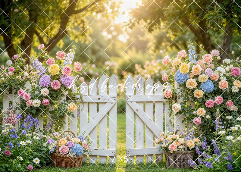 Pastel garden gate photography backdrop with a white picket gate, soft spring florals, and a romantic sunlit garden setting for portrait photography.