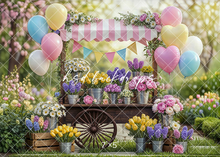 Spring flower cart backdrop with pastel balloons, vibrant garden blooms, and vintage cart for photography