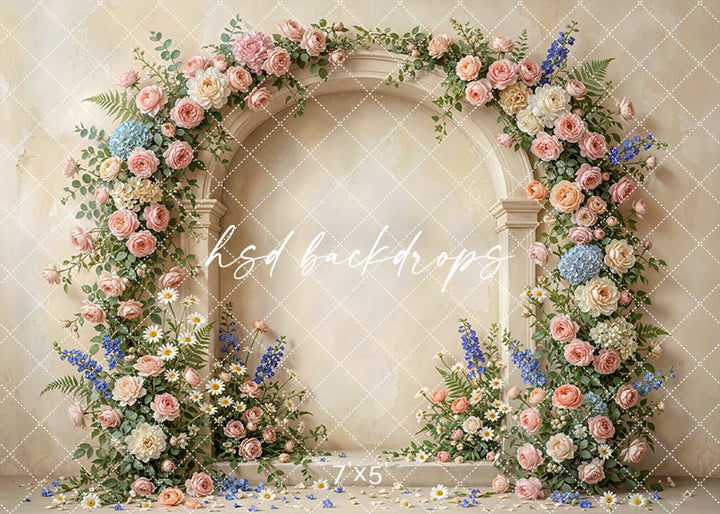 Blush garden floral arch photography backdrop with cascading blush roses, daisies, and greenery for elegant portrait photography.