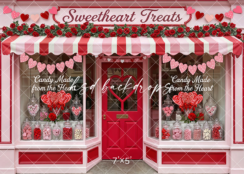 Valentine’s candy shop backdrop with pink and red awning, heart garlands, roses, and jars of sweets