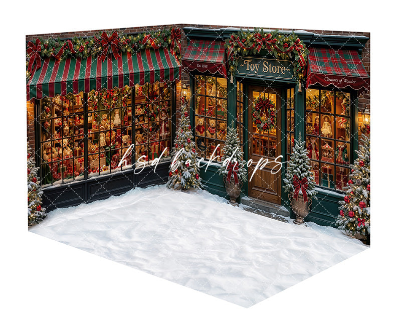 Merry Toy Boutique Room Photography Backdrop featuring a vintage Christmas toy store storefront with festive display windows, red and green striped awnings, snowy evergreens, glowing lights, holiday garland, and a snowy floor area for holiday portraits.