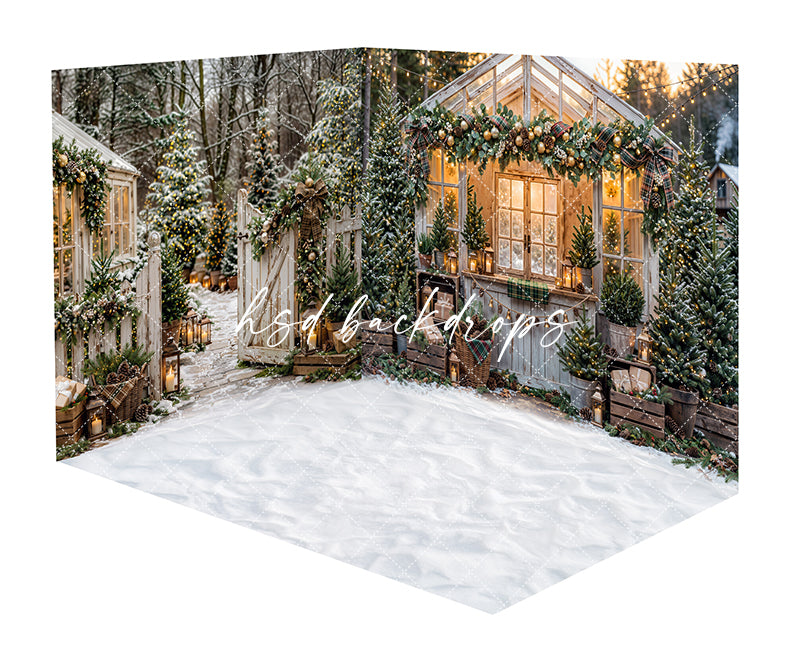 Plaid Garland Greenhouse Room Photography Backdrop featuring a snowy Christmas greenhouse with glowing windows, plaid garland, snowy evergreens, string lights, lanterns, rustic crates, potted trees, and a snowy floor for holiday portraits.
