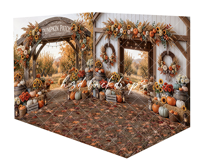 Autumn Barnway Room Photography Backdrop featuring a rustic pumpkin patch entrance with a wooden arch, barn doorway, fall florals, sunflowers, pumpkins, lanterns, wreaths, autumn leaves, and leaf-covered floor for fall portraits.