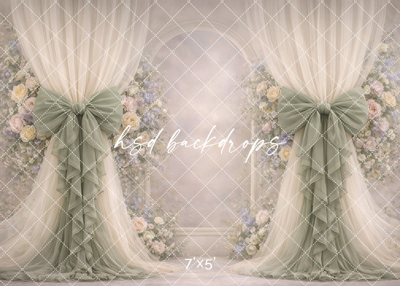 Soft sage rose bow photography backdrop with elegant floral arch and muted draped curtains for romantic portrait sessions.