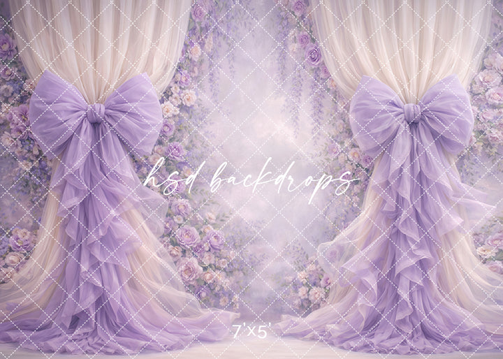 Lavender lilac rose bow photography backdrop with romantic floral arch and flowing draped curtains for elegant portrait sessions.