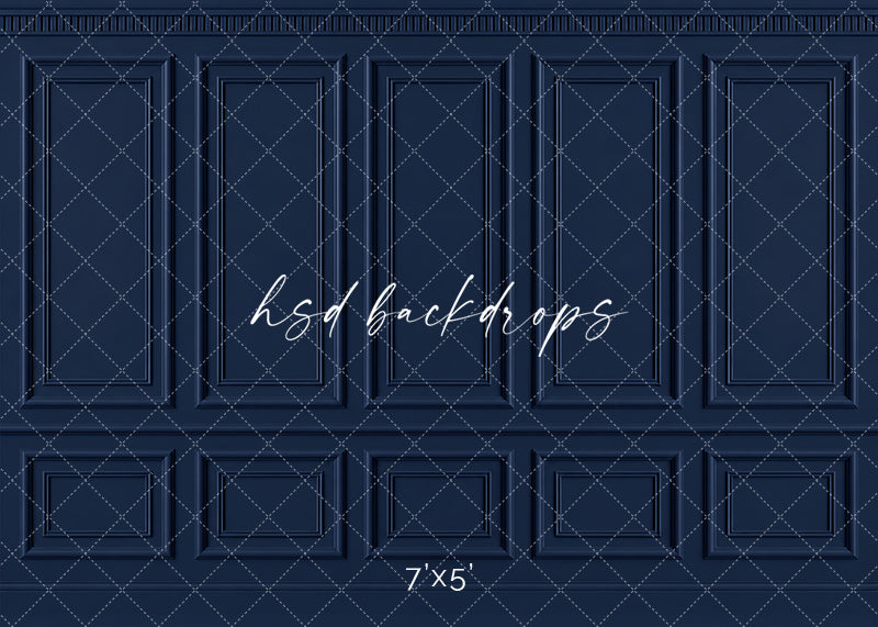 Classic Navy French Panel photography backdrop featuring traditional French-inspired boiserie wall molding, five tall symmetrical rectangular panels, ornate dentil-style crown molding, a classic chair rail, and coordinating lower wainscoting in a rich midnight navy blue finish for fine art, maternity, branding, and elegant studio portraits.