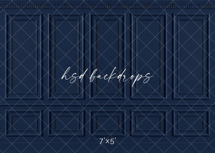 Classic Navy French Panel photography backdrop featuring traditional French-inspired boiserie wall molding, five tall symmetrical rectangular panels, ornate dentil-style crown molding, a classic chair rail, and coordinating lower wainscoting in a rich midnight navy blue finish for fine art, maternity, branding, and elegant studio portraits.